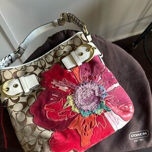 Limited Edition Coach handbag. Floral design is hands tucked leather/suede.